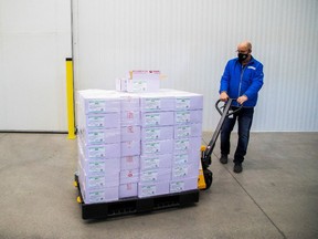 Michael Gray moves some of the 2-million AstraZeneca coronavirus vaccine that Canada has secured at a facility in Milton, Ontario, Canada March 3, 2021.