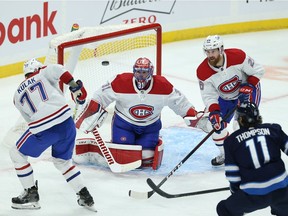 Montreal Canadiens goaltender Carey Price follows an airborne puck against the Winnipeg Jets in Winnipeg on Mon., March 15, 2021.