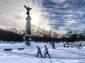 A high temperature of 5 Celsius brought Montrealers out to places around town like the Sir George-Etienne Cartier statue on Mount Royal on Sunday February 28, 2021.
