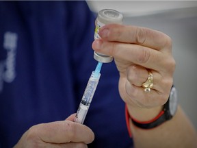 A syringe is filled with vaccine at the COVID-19 vaccination clinic at Bob Birnie Arena in Pointe-Claire on March 8.