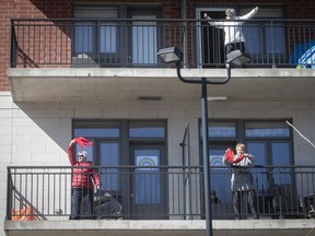 Seniors participate in an outdoor Zumba class from the balcony of a seniors residence in Blainville last year.