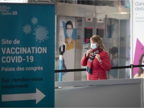 A woman arrives at the Palais des congrès vaccination centre.