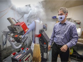 André Bruneau steam-presses a man's shirt at one of his Nettoyeur Délicat locations. "What we’ve lost in shirts, we’ve made up a little in sheets and bedspreads, which people seem to notice more now, because they’re under them more than ever.”