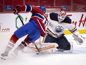 Canadiens defenceman Brett Kulak tries to stuff the puck past Edmonton Oilers goaltender Mikko Koskinen in Montreal on March 30, 2021.