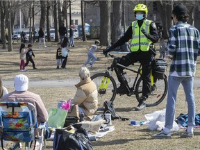 Montreal police officers took to their bikes on Sunday, April 4, 2021, to remind people at La Fontaine Park to keep a proper social distance during the COVID-19 pandemic. Quebec reported more than 1,000 new COVID-19 cases for the fifth day in a row on Sunday, confirming 1,154 new infections.