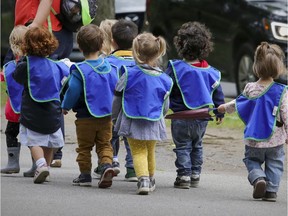 Daycare children walk down a street in the Plateau Mont-Royal district. Daycare educators have launched a two-day strike.
