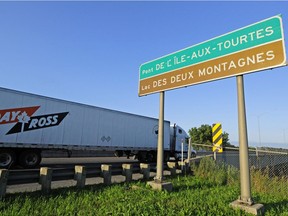 A truck crosses the Île-aux-Tourtes bridge into Vaudreuil-Dorion.