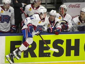 The Laval Rocket’s Cole Caufield jumps over the boards on line change during Friday night’s AHL game against the Marlies in Toronto.