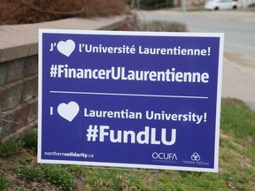 Signs have been popping up in Sudbury, Ont., showing support for students, staff and faculty at Laurentian University.