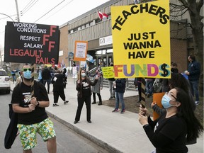 Teachers from LaSalle Community Comprehensive High School stage a protest against lagging contracts talks on April 14, 2021.