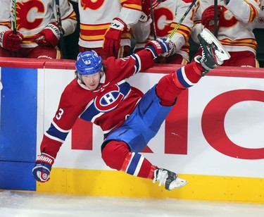 Tyler Toffoli is knocked in the air by a check from Noah Hanifin during third period at the Bell Centre in Montreal on Wednesday, April 14, 2021.
