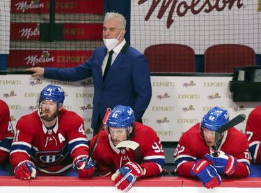 Montreal Canadiens head coach Dominic Ducharme watches the last minute of third period during third period at the Bell Centre in Montreal on Wednesday, April 14, 2021. In front of Ducharme: players Paul Byron, left, Jonathan Drouin and Artturi Lehkonen.