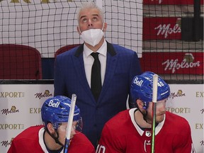 Canadiens head coach Dominique Ducharme looks up at the scoreboard during 4-1 loss to the Calgary Flames Wednesday night at the Bell Centre.