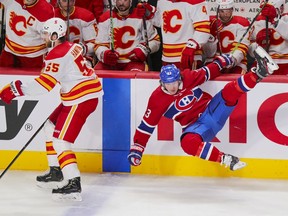 The Canadiens’ Tyler Toffoli gets upended by Calgary Flames defenceman Noah Hanifin during third period of Wednesday night’s game at the Bell Centre.