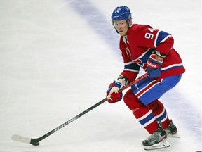 Montreal Canadiens' Corey Perry moves the puck up the ice during the first period against the Calgary Flames in Montreal on April 14, 2021.
