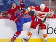 Artturi Lehkonen is knocked off balance by Michael Stone during second period at the Bell Centre in Montreal on Wednesday April 14, 2021.