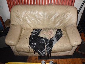 The couch Cedric Gagnon was killed on. Raymond Henry Muller confessed that he hit Gagnon with a bass guitar as Gagnon slept on this couch. On Thursday, a DNA expert confirmed blood with Gagnon's DNA was found on the couch.