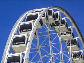 La Grande Roue de Montréal operates on a blue-sky day in Montreal on April 27, 2021.