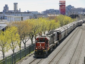 A freight train passes through the Old Port of Montreal on April 27, 2021