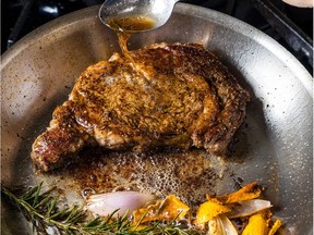 Butter-basted rib steak featured in Meat Illustrated by America's Test Kitchen.