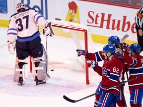 Canadiens' Artturi Lehkonen (62) celebrates scoring against Jets goaltender Connor Hellebuyck Friday night at teh Bell Centre.