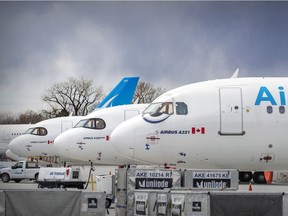 Idle Air Transat jets parked at Montreal-Pierre Elliott Trudeau International Airport.