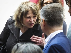 Patricia Tulasne speaks with her lawyer outside the Quebec Court of Appeal in Montreal in May 2019. Tulasne was part of the group of women dubbed Les Courageuses who tried to bring a class action suit against Gilbert Rozon.