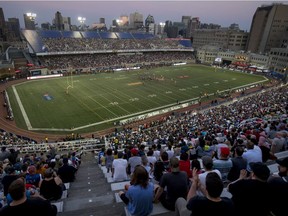 Fans watch the Montreal Alouettes take on the Hamilton Tiger-Cats during Canadian Football League game at Molson Stadium in Montreal on July 4, 2019.