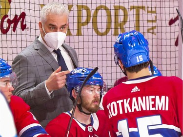 Coach Dominique Ducharme gives instructions to Jesperi Kotkaniemi during the third period at the Bell Centre in Montreal on Thursday, April 8, 2021.