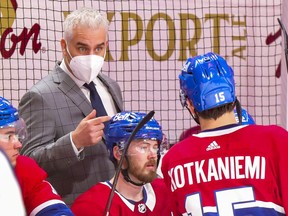 Canadiens head coach Dominque Ducharme gives instructions to Jesperi Kotkaniemi during Thursday night’s game against the Winnipeg Jets at the Bell Centre.
