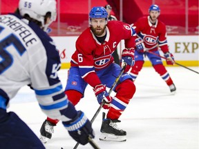Montreal Canadiens captain Shea Weber defends against Winnipeg Jets' Mark Scheifele during second period in Montreal on April 8, 2021.