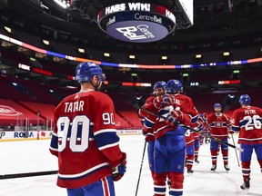 Eric Staal is hugged by captain Shea Weber while Tomas Tatar looks on after scoring in overtime to give the Canadiens a 3-2 win over the Edmonton Oilers Monday night at the Bell Centre.