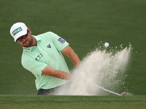 Corey Conners of Canada plays a shot from a bunker on the second hole during the third round of the Masters at Augusta National Golf Club on Saturday, April 10, 2021, in Augusta, Ga.