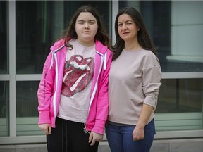 Stephanie Peillon with her daughter Rebecca Marchand outside the Montreal Children's Hospital in Montreal.  Rebecca has been hospitalized for weeks with what doctors believe could be Multisystem inflammatory syndrome in children (MIS-C), a rare, post-COVID-19 syndrome in children becoming more frequent in Montreal.