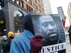 Demonstrators march through downtown Minneapolis demanding justice the day before guilty verdicts were handed down to former Minneapolis police officer Derek Chauvin for the murder of George Floyd.