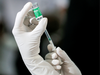 A health official draws a dose of AstraZeneca's COVID-19 vaccine