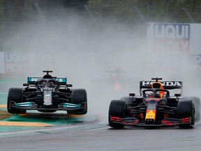 Red Bull's Max Verstappen, right, and Mercedes' Lewis Hamilton in action during the Emilia Romagna Grand Prix at Autodromo Enzo e Dino Ferrari, Imola, Italy, April 18, 2021.