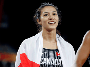 Canada’s Nina Schultz celebrates after winning a silver medal at the 2018 Commonwealth Games in Australia. She hopes to compete for China in the upcoming Olympics.