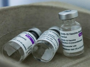 Vials of used Oxford AstraZeneca COVID-19 coronavirus vaccine lay discarded at a make-shift vaccination centre at the Cyprus State Fair grounds in the capital Nicosia's suburb of Engomi on April 15, 2021.