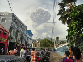 Ash and smoke billow as the La Soufriere volcano erupts in Kingstown on the eastern Caribbean island of St. Vincent on Friday, April 9, 2021.
