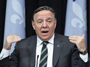 Quebec Premier François Legault responds to reporters' questions during a news conference on the COVID-19 pandemic, Wednesday, March 31, 2021 at the legislature in Quebec City.