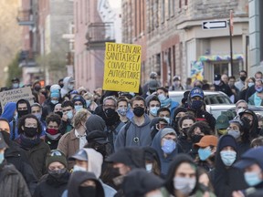 People demonstrate against Quebec's 8 p.m. curfew in Montreal on April 18, 2021.