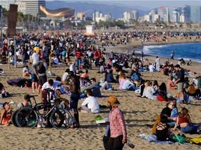 People pack the Barceloneta beach amid the COVID-19 outbreak, in Barcelona, Spain, on Friday, April 2, 2021.