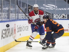 Canadiens captain Shea Weber and Oilers' Gaetan Haas battle for the puck during second period Monday night in Edmonton.