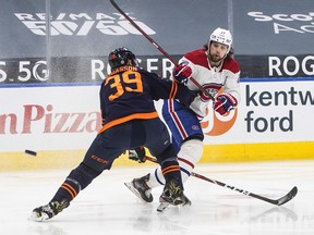 Oilers' Alex Chiasson tries to stop the shot from Canadiens' Josh Anderson during third period Wednesday night in Edmonton.