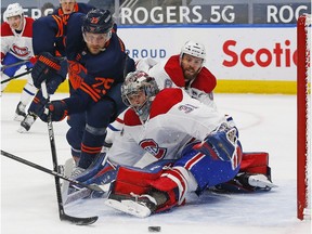 Montreal Canadiens goaltender Carey Price makes a save on Edmonton Oilers forward Leon Draisaitl during the first period at Rogers Place in Edmonton on April 19, 2021.