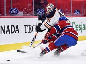 Montreal Canadiens forward Brendan Gallagher (11) forechecks on Edmonton Oilers goalie Mike Smith (41) during the first period at the Bell Centre April 5, 2021.