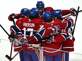 Canadiens' Tyler Toffoli (73) celebrates with teammates after scoring a goal against the Ottawa Senators during the first period at the Bell Centre on Saturday, April 3, 2021.