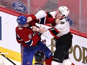 Canadiens' Shea Weber (6) and Ottawa Senators' Brady Tkachuk (7) fight during the first period at Bell Centre on Saturday, April 3, 2021.