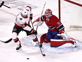Ottawa Senators' Colin White plays the puck in front of Canadiens goaltender Carey Price during the first period at the Bell Centre on Saturday, April 17, 2021, in Montreal.